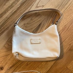 Cream colored Kate Spade shoulder bag.